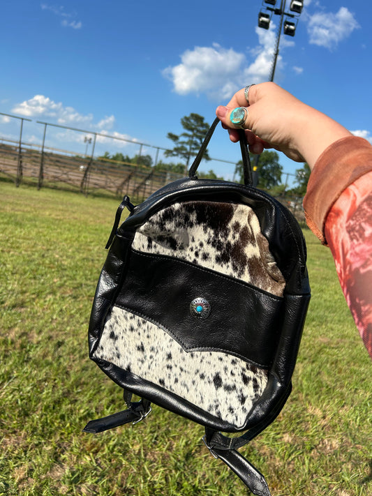 Cowhide and concho mini backpack