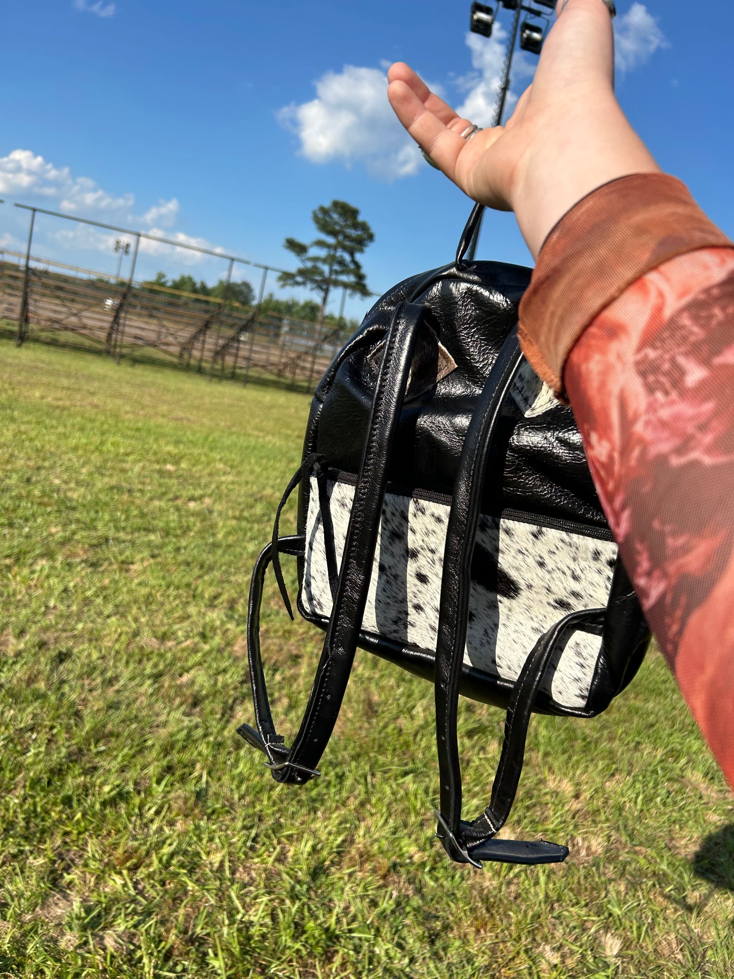 Cowhide and concho mini backpack